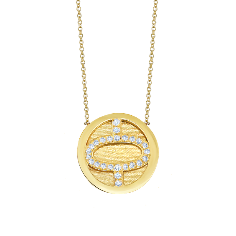 Inspired by ancient Roman prosperity, this 14K yellow gold medallion from a collection of twelve features white pave diamonds spelling a birth month, inviting personalized meaning and history - Gabriela Artigas
