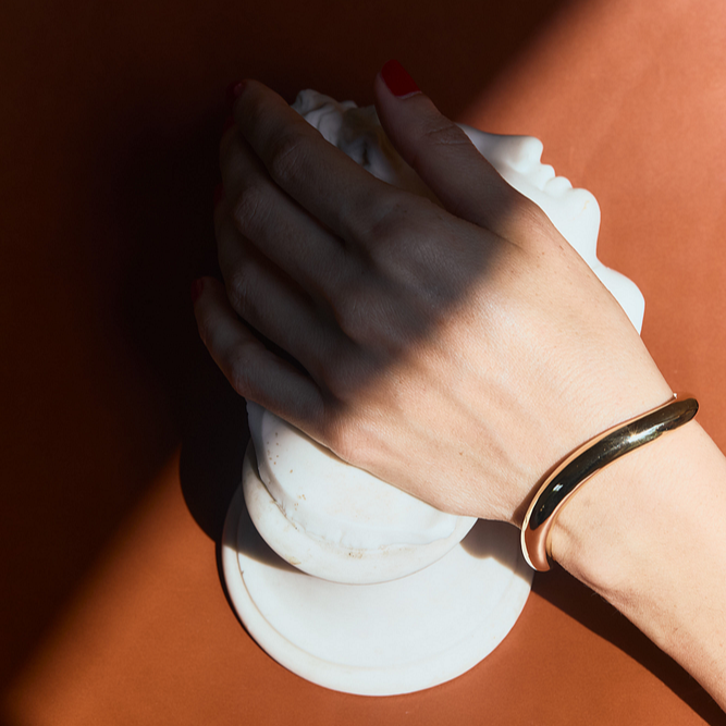 Gold vermeil Wave Cuff with sculptural curves capturing fluid motion, nesting femininely on the wrist, inspired by the Classic Infinite Tusk Collection - Gabriela Artigas