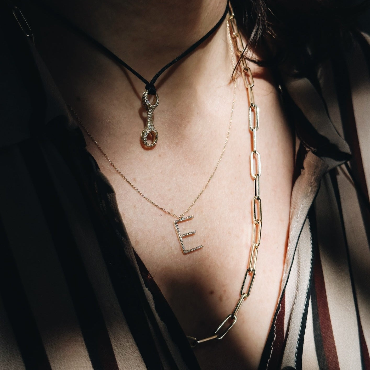 Grande initial letters adorned with white pavé diamonds on a delicate chain – a sparkling, personalized touch- Gabriela Artigas