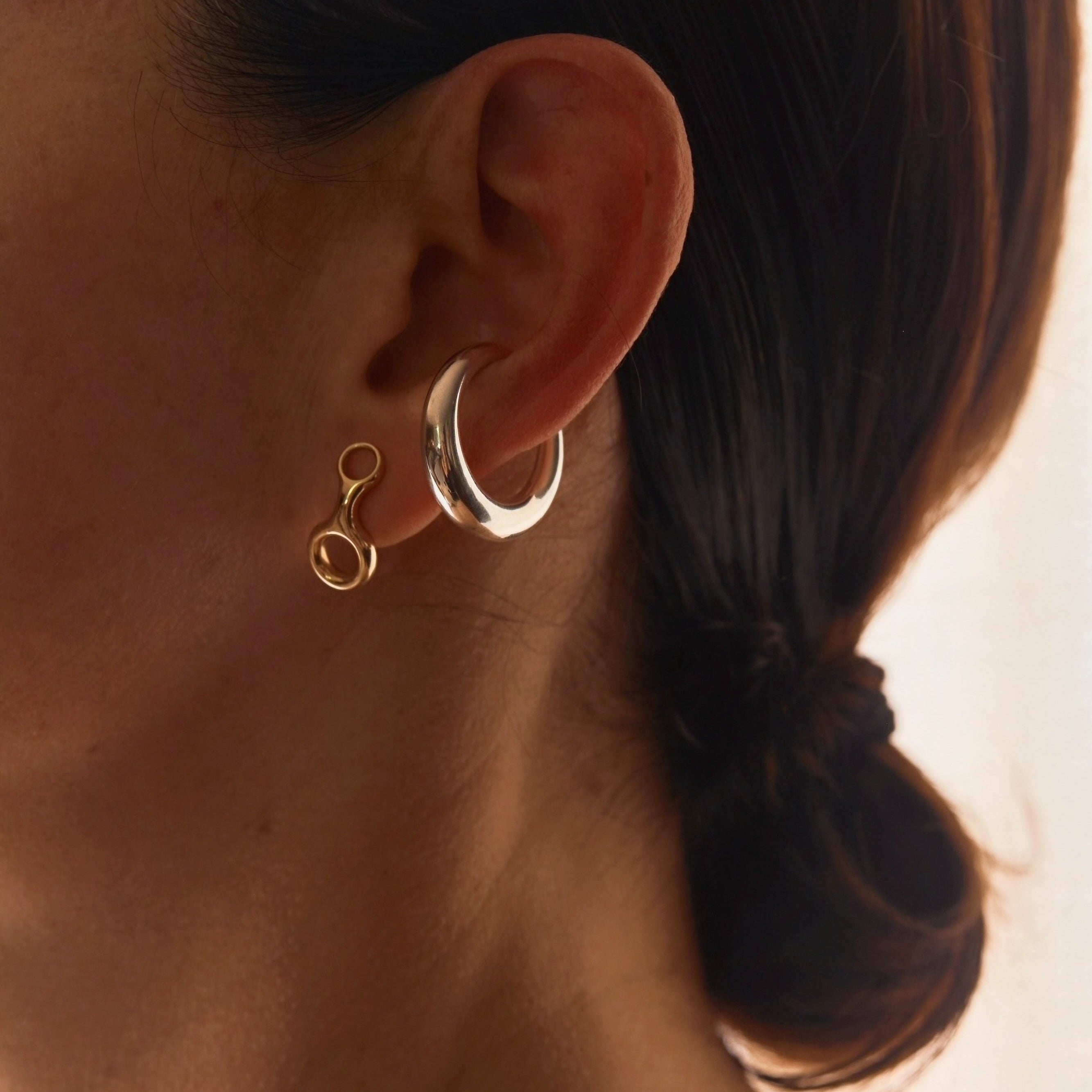 Yellow gold Grande Colmillo Ear Cuff, a statement piece with fluid curves and a defined frame, crafted for bold ear styling - Gabriela Artigas