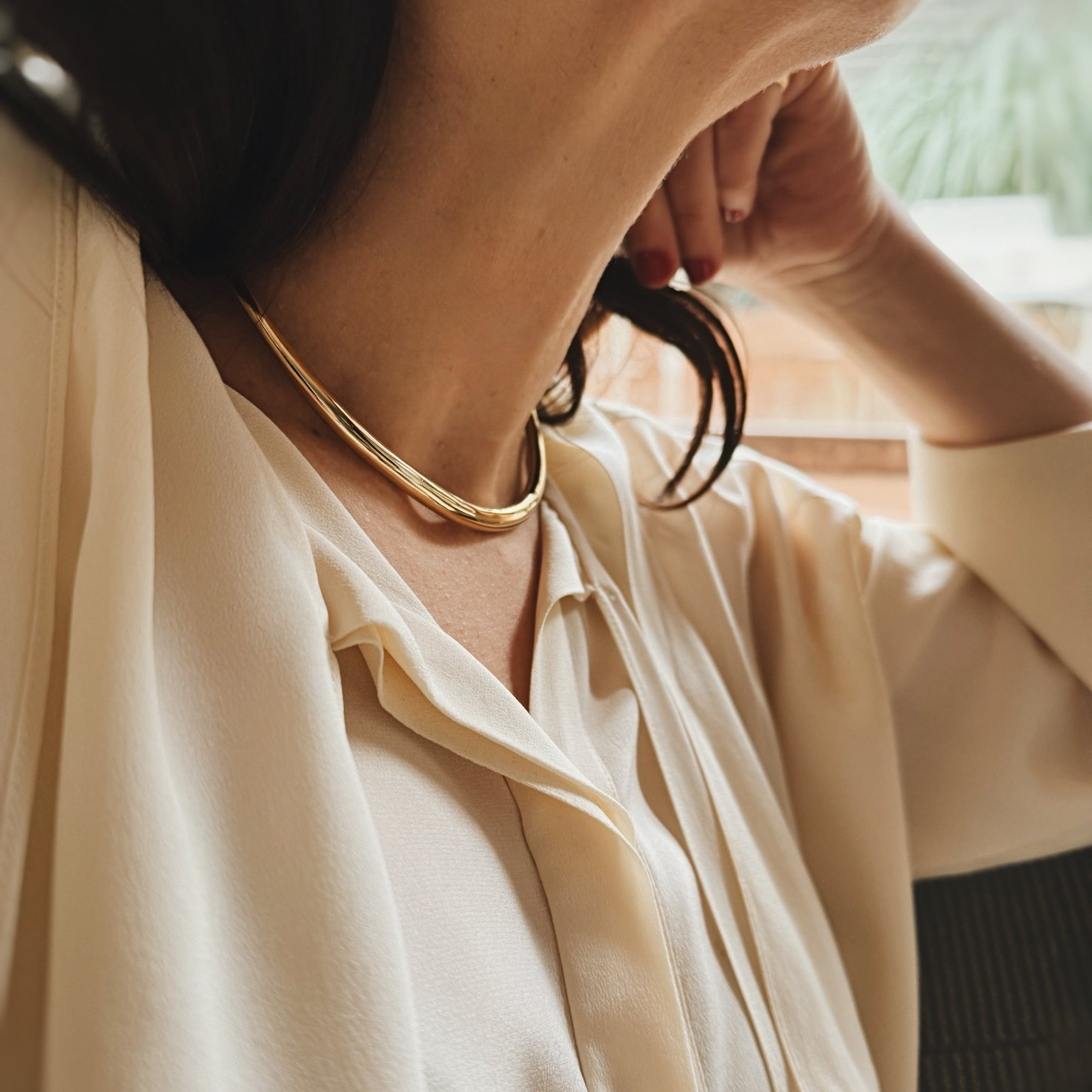 Gabriela Artigas’ Tusk Solid Choker in yellow gold plate, a solid, slightly heavier piece, graces the collarbone with chic, statement-making sophistication - Gabriela Artigas