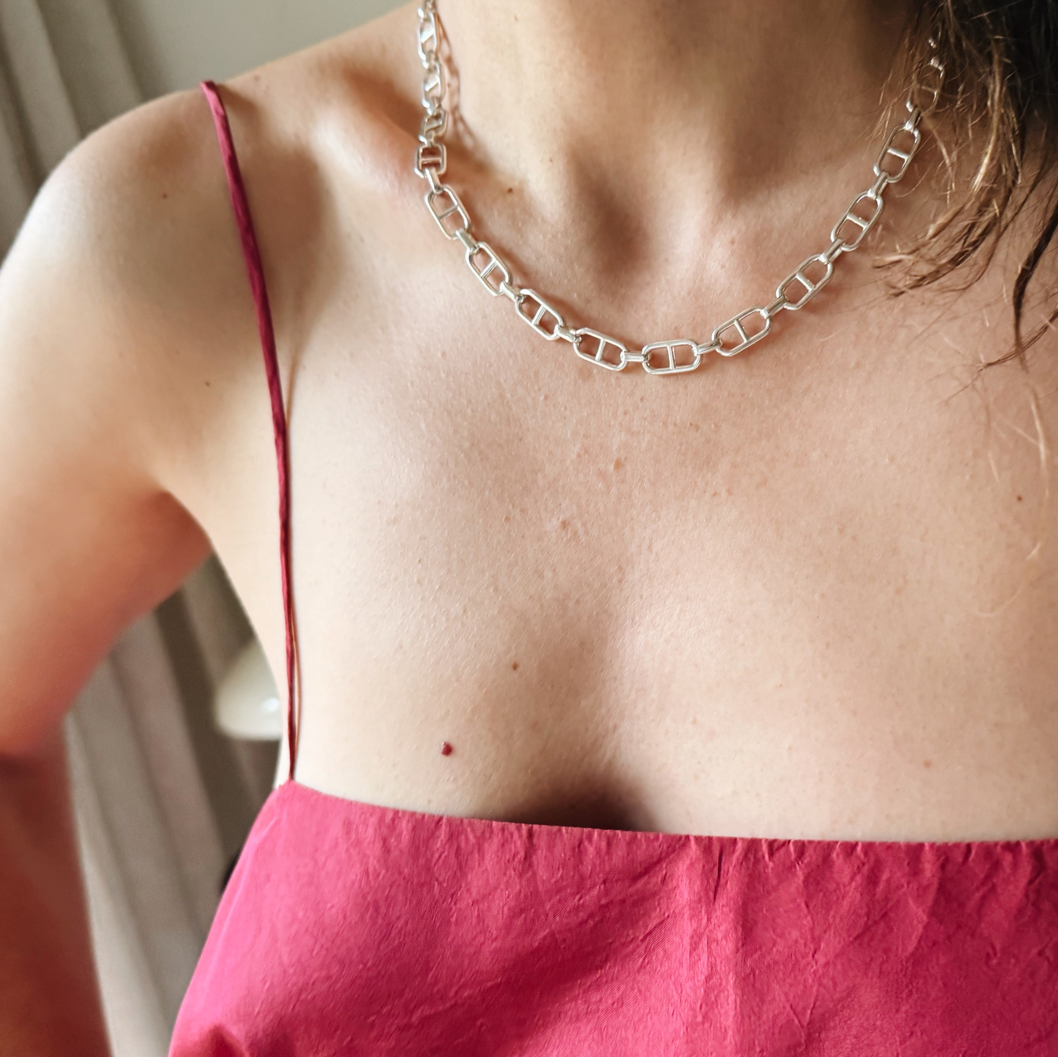 The Stirrup Link Chain & Necklace in sterling silver honors necessity and refinement, featuring two mirroring stirrups in its link design, complete with a signature Tusk Clasp for iconic elegance - Gabriela Artigas