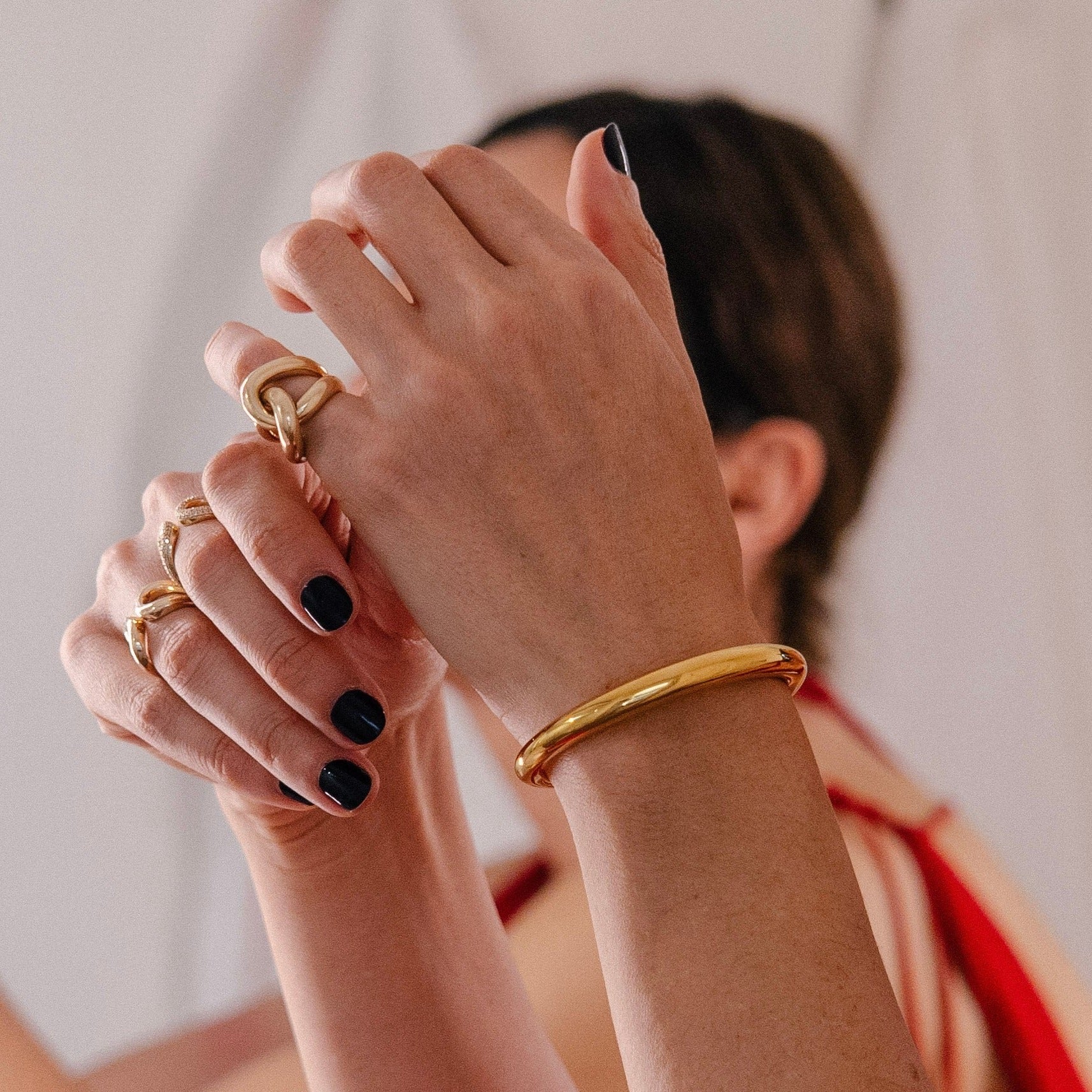 Designer Infinite Tusk gold jewelry cuff, yellow gold plated with a tapered silhouette, wrapping the wrist for versatile, elegant styling - Gabriela Artigas