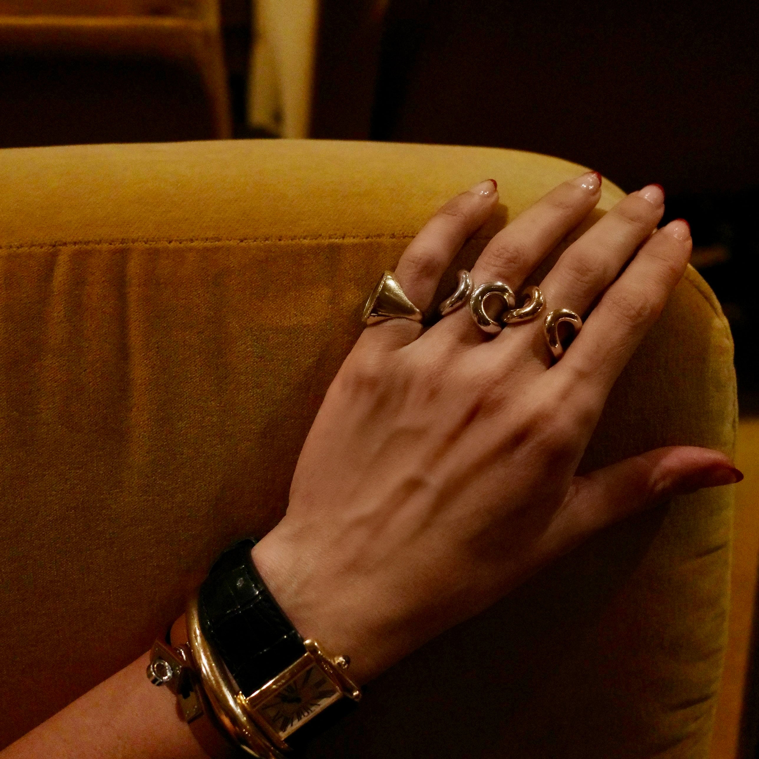 Hand wearing Grande Double Beam Rings, Vintage Coin Ring and Infinite Tusk Cuff from Gabriela Artigas & Co