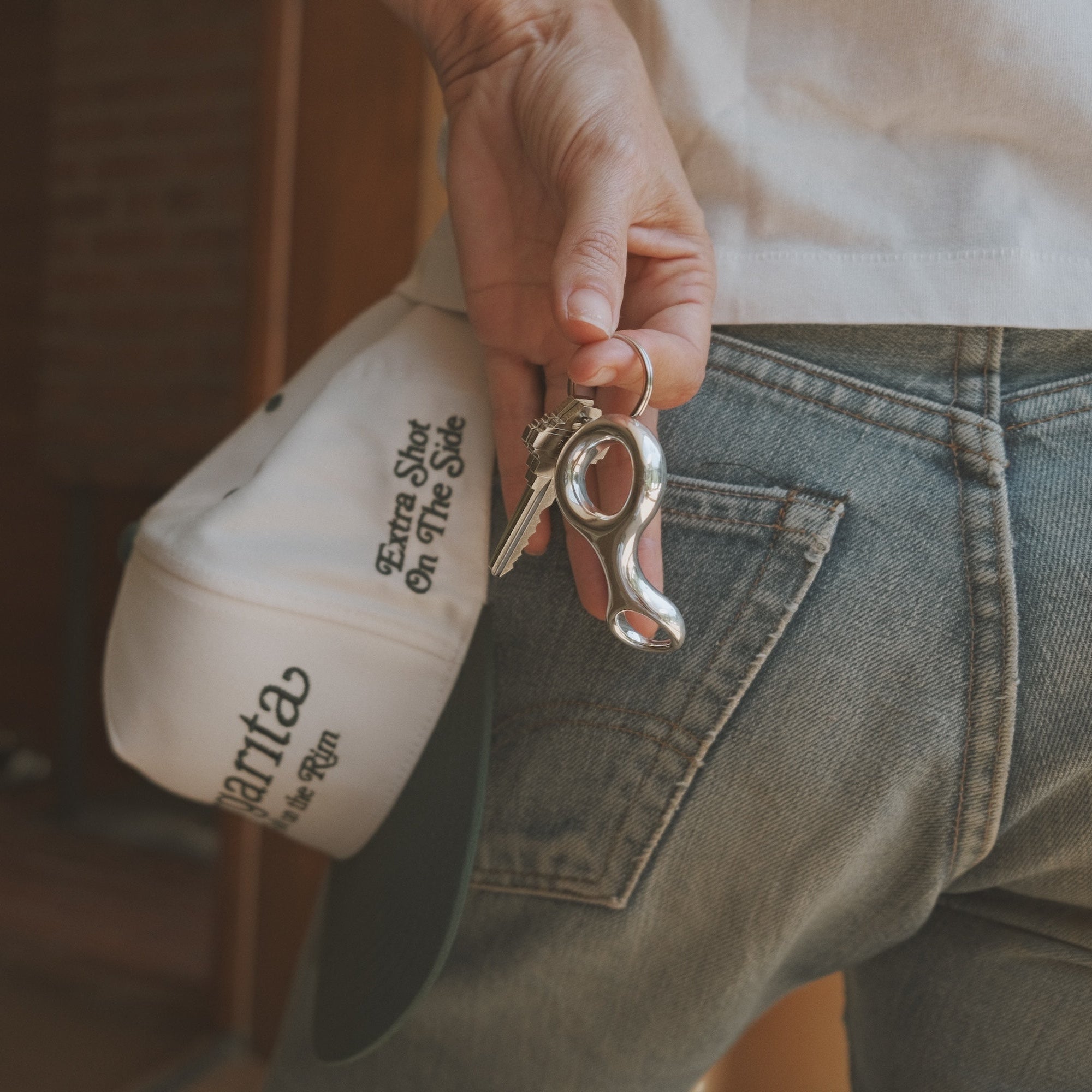 Embroidered white and green Margarita Hat with "Margarita with salt on the rim, extra shot on the side," paired with a double beam Ray Key Chain for a bold accessory set - Gabriela Artigas