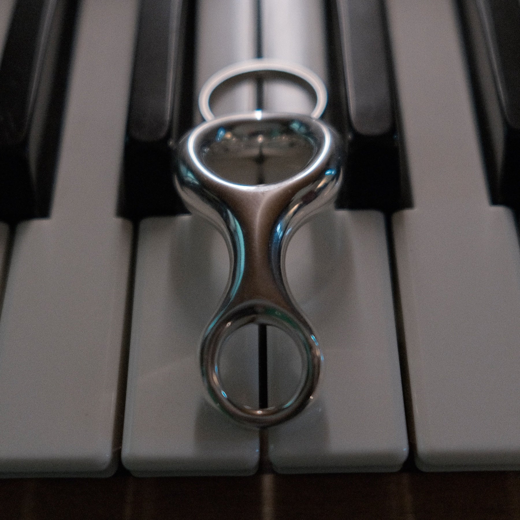 Architectural Ray Key Chain, yellow gold plated, inspired by Double Beam shapes, offers a bold, streamlined accessory - Gabriela Artigas