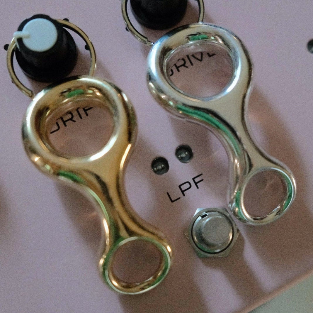 Sleek Ray Key Chain in sterling silver yellow gold plate reimagines minimalism with a Double Beam-inspired architectural form, elevating everyday essentials - Gabriela Artigas