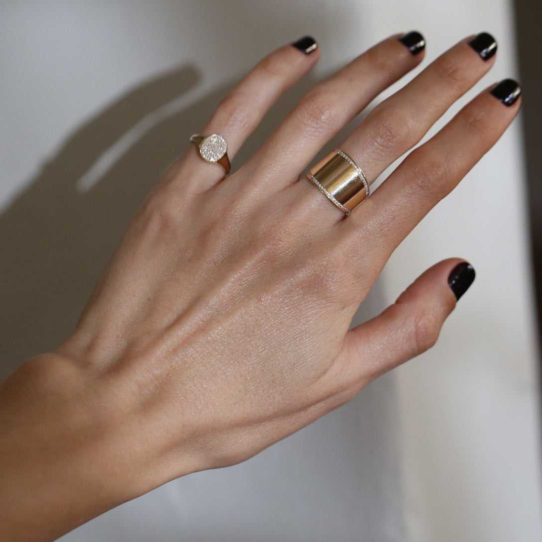 Cigar band ring featuring double lines of white pavé diamonds, offering a luxurious and sophisticated design- Gabriela Artigas