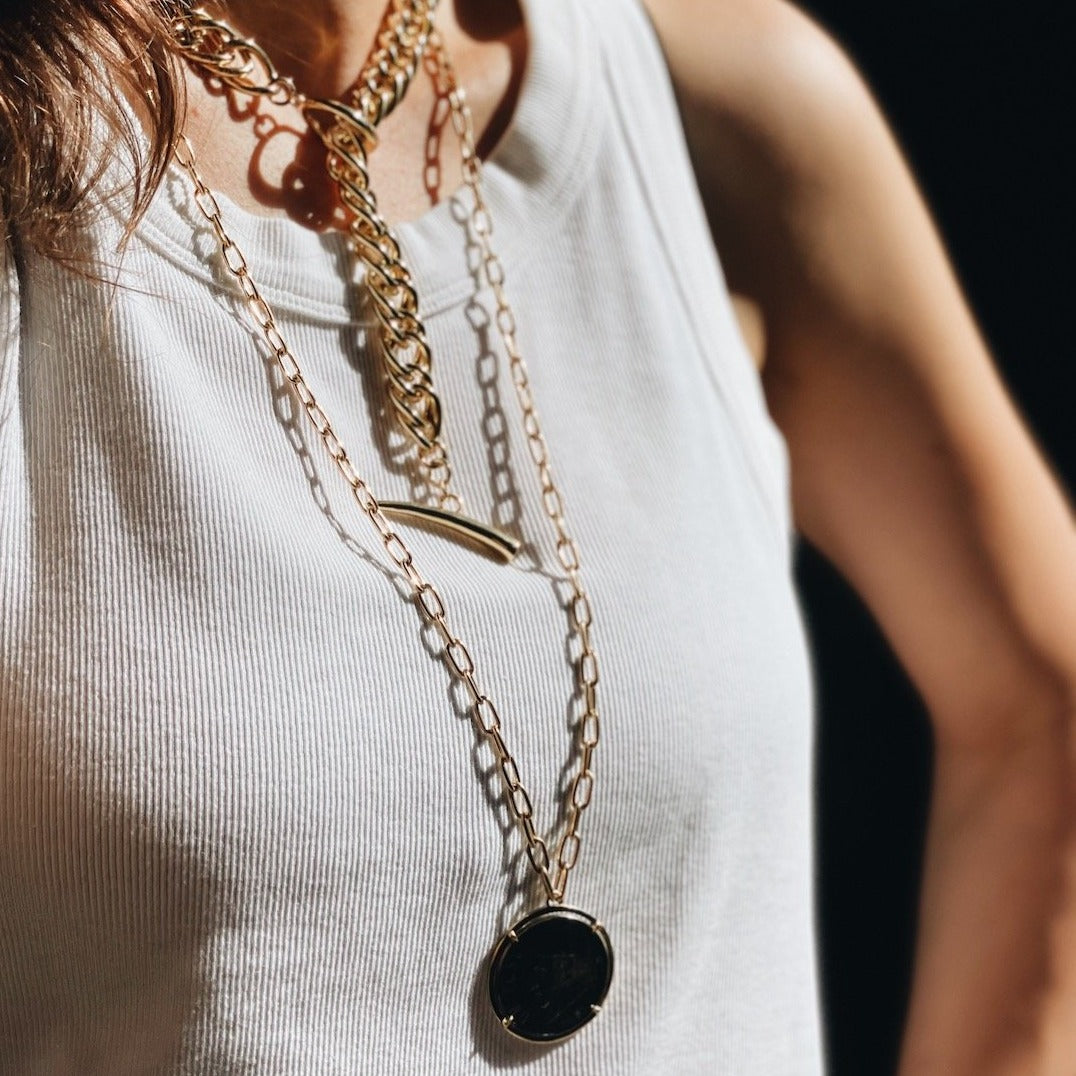 Two-tone Vintage Mexican Peso Necklace with a gold chain, a statement piece blending casual urban style with luxurious flair - Gabriela Artigas