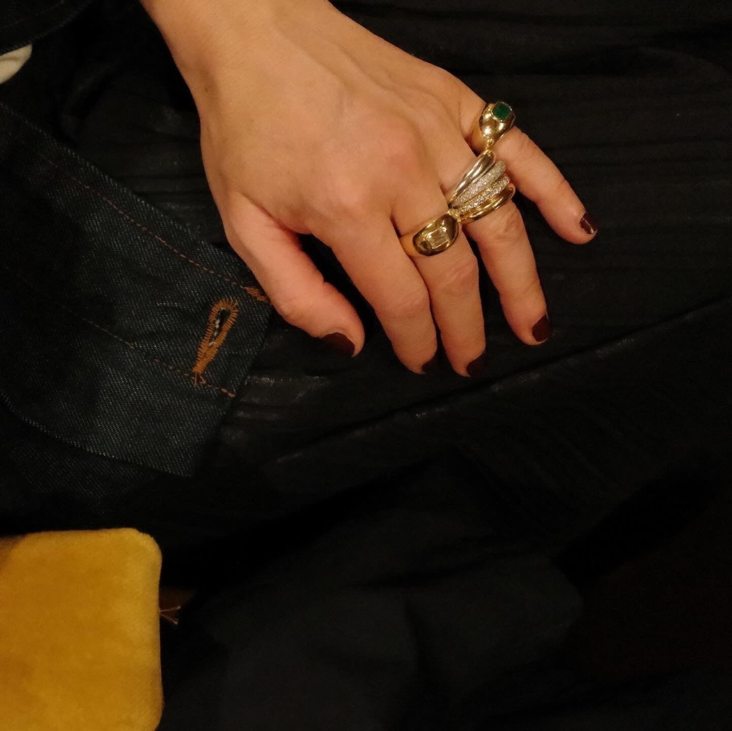 Hand Wearing Gabriela Artigas & Co Ballon Ring with Diamond Baguette and Emereald Baguette